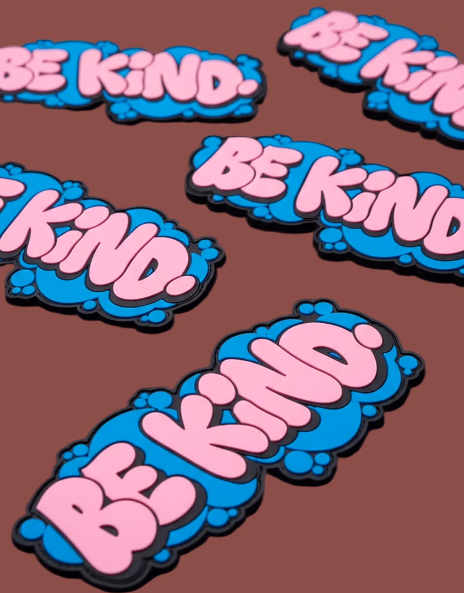 Premium 2-color custom PVC patch with the BE KIDS logo and soft rubber material.